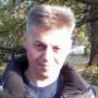 николай