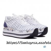 Магазини одягу та взуття Status фото