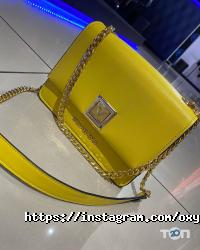 Магазини одягу та взуття Oxygen фото