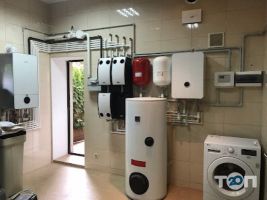 Moderno fontanero фото