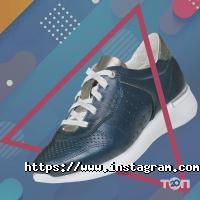 Магазини одягу та взуття MІDA фото