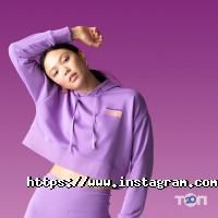 Спортивний одяг та інвентар New Balance фото