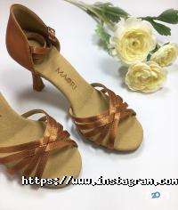 Магазини одягу та взуття Мілонга фото